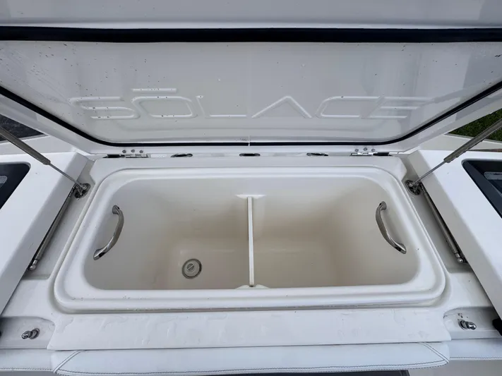 Call Today! 32 #55 Yacht Photos Pics Open storage compartment of 2025 Solace 32 CS boat, featuring sleek design and sturdy handles.