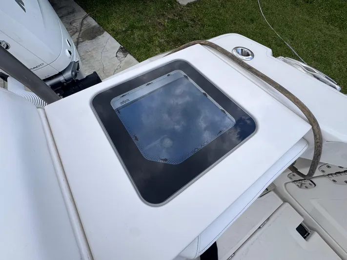 Call Today! 32 #55 Yacht Photos Pics 2025 Solace 32 CS boat deck with a glass hatch and strap.