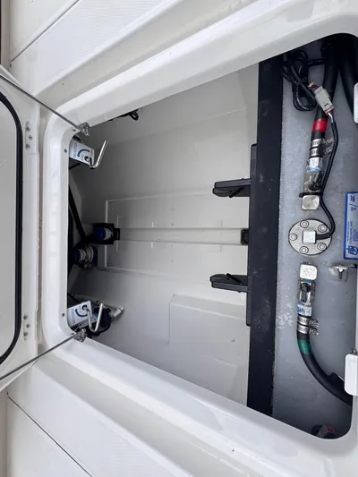 Call Today! 32 #55 Yacht Photos Pics 2025 Solace 32 CS boat storage compartment with visible wiring and fittings.