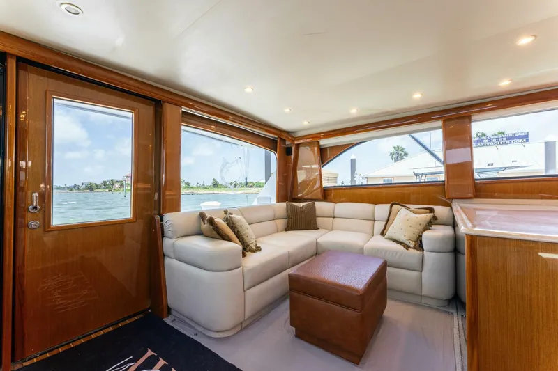 Wound Tight Yacht Photos Pics Luxurious interior of 2004 Viking 48 Convertible yacht with plush seating and scenic windows.