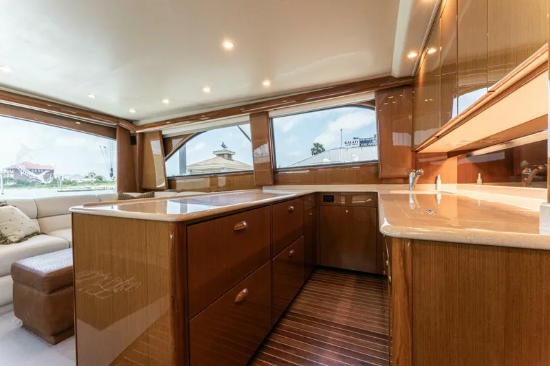 Wound Tight Yacht Photos Pics Luxurious interior of 2004 Viking 48 Convertible yacht with polished wood finishes.