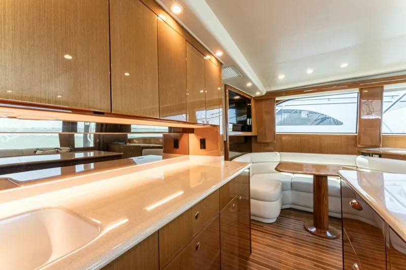 Wound Tight Yacht Photos Pics Luxurious interior of 2004 Viking 48 Convertible yacht with wood finishes and modern amenities.