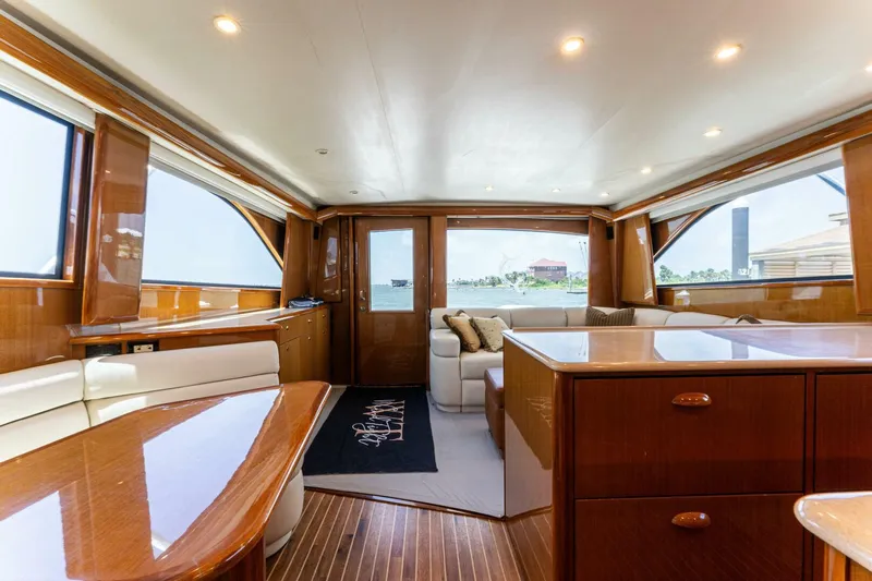 Wound Tight Yacht Photos Pics Luxurious interior of a 2004 Viking 48 Convertible yacht with elegant wood finishes and plush seating.