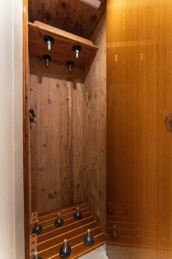 Wound Tight Yacht Photos Pics Wooden interior of a 2004 Viking 48 Convertible yacht, featuring a custom rod holder.