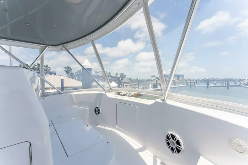 Wound Tight Yacht Photos Pics 2004 Viking 48 Convertible yacht interior with marina view through windows.