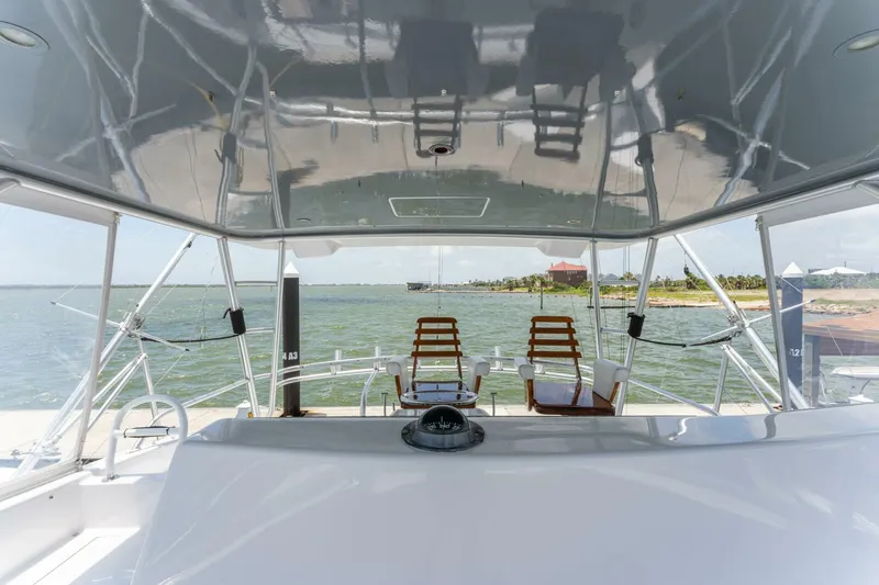 Wound Tight Yacht Photos Pics 2004 Viking 48 Convertible yacht interior with ocean view and seating area.