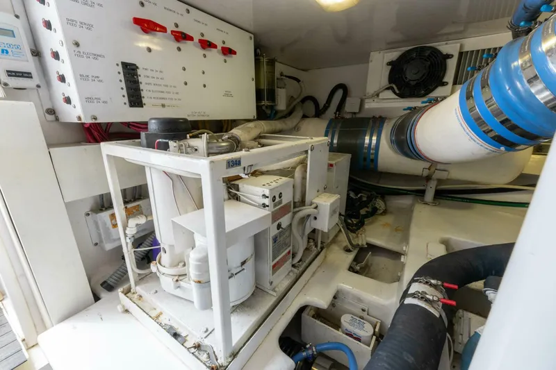 Wound Tight Yacht Photos Pics Engine room of 2004 Viking 48 Convertible yacht, showcasing mechanical and electrical systems.