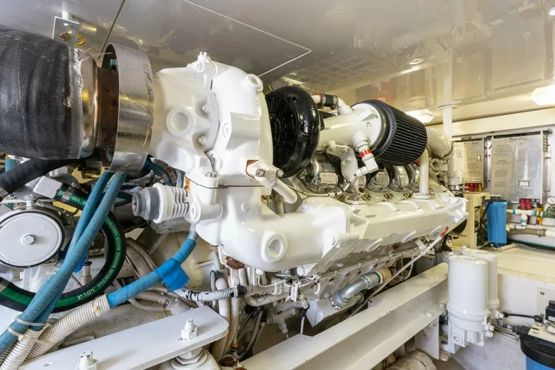 Wound Tight Yacht Photos Pics Engine room of 2004 Viking 48 Convertible yacht, showcasing powerful marine engine components.