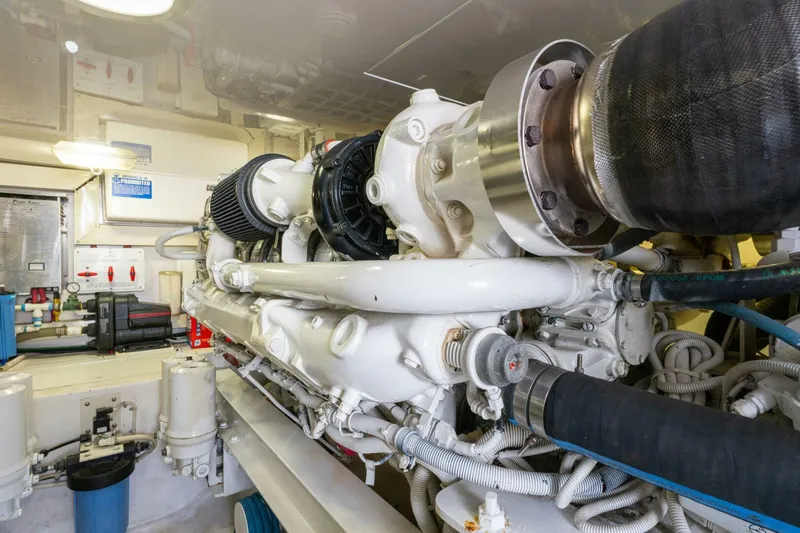 Wound Tight Yacht Photos Pics Engine room of 2004 Viking 48 Convertible yacht, showcasing detailed machinery and components.