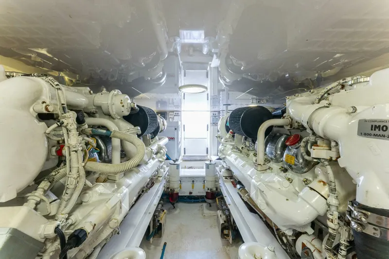 Wound Tight Yacht Photos Pics Engine room of 2004 Viking 48 Convertible yacht, showcasing dual engines and mechanical components.