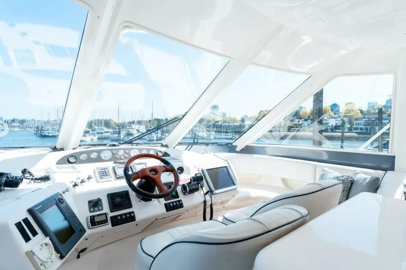 Jugni Yacht Photos Pics Luxurious 2003 Viking Princess 65 yacht interior with modern helm and panoramic windows.