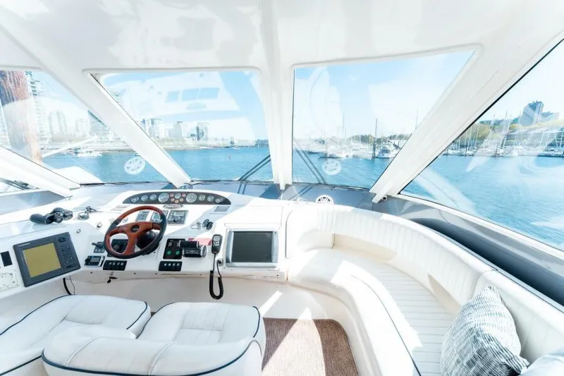 Jugni Yacht Photos Pics Luxurious 2003 Viking Princess 65 yacht interior with panoramic views and modern navigation equipment.