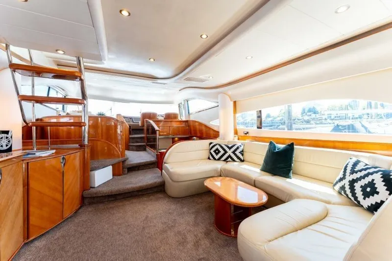 Jugni Yacht Photos Pics Luxurious interior of 2003 Viking Princess 65 yacht with elegant seating and modern design.