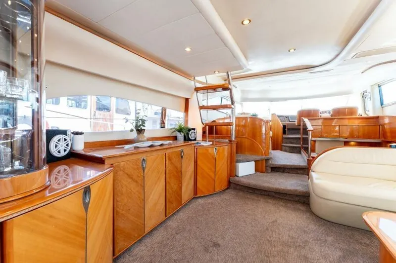 Jugni Yacht Photos Pics Luxurious interior of 2003 Viking Princess 65 yacht with elegant wood finishes.