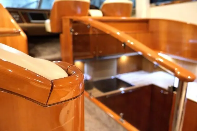 Jugni Yacht Photos Pics Luxurious interior of 2003 Viking Princess 65 yacht with polished wood and elegant seating.