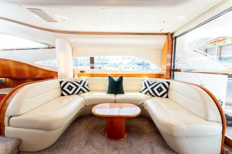 Jugni Yacht Photos Pics Luxurious 2003 Viking Princess 65 yacht interior with elegant seating and stylish decor.
