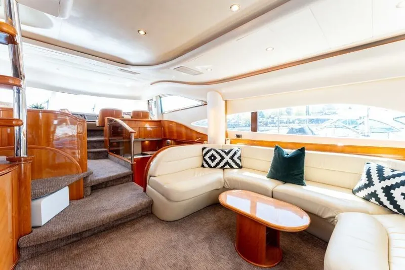 Jugni Yacht Photos Pics Luxurious interior of 2003 Viking Princess 65 yacht with elegant seating and modern design.