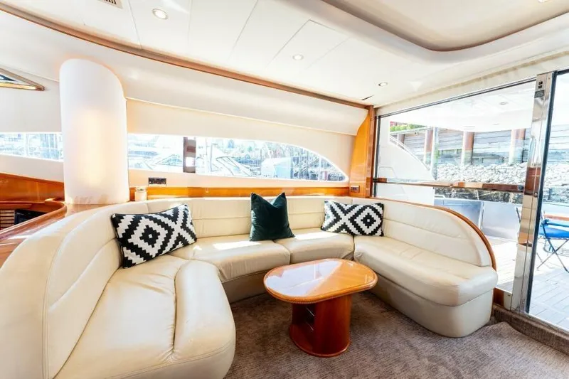 Jugni Yacht Photos Pics Luxurious interior of 2003 Viking Princess 65 yacht with elegant seating and stylish decor.