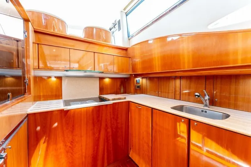 Jugni Yacht Photos Pics Luxurious wooden kitchen interior of 2003 Viking Princess 65 yacht.