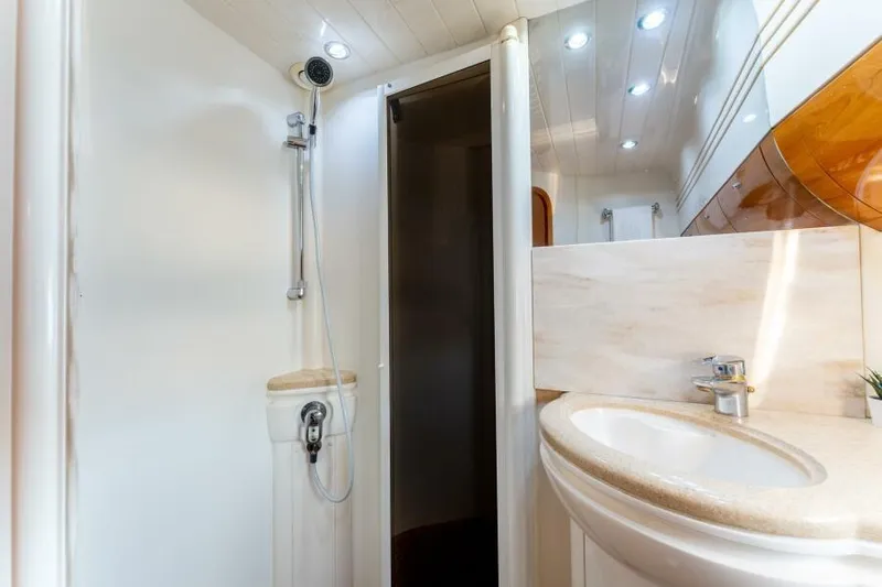 Jugni Yacht Photos Pics Luxurious bathroom in 2003 Viking Princess 65 yacht with modern fixtures.