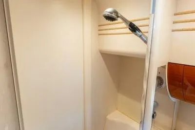 Jugni Yacht Photos Pics Shower area in 2003 Viking Princess 65 yacht, featuring sleek design and modern fixtures.