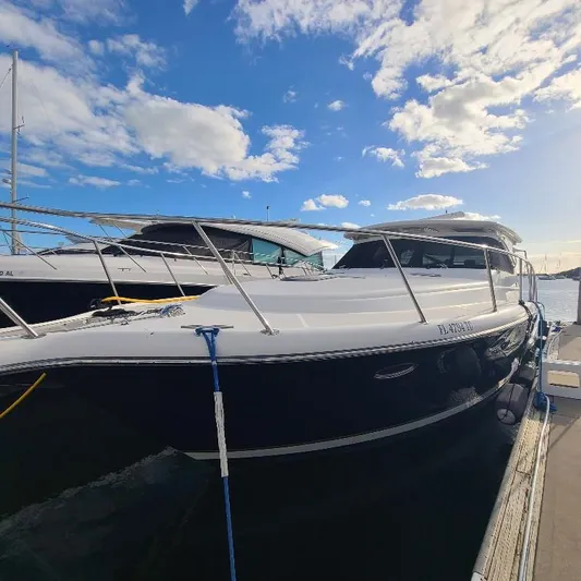 Blue Meridian Yacht Photos Pics 2003 Tiara Yachts 3800 Open docked under a bright blue sky.