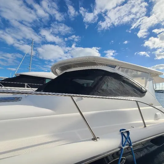Blue Meridian Yacht Photos Pics 2003 Tiara Yachts 3800 Open docked under a bright blue sky.