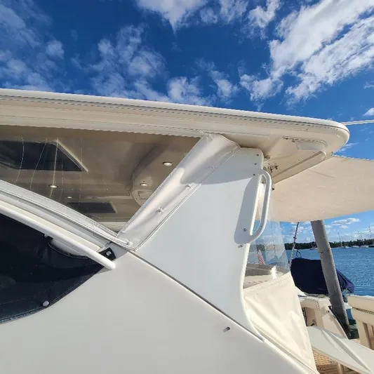 Blue Meridian Yacht Photos Pics 2003 Tiara Yachts 3800 Open, partial view under clear blue sky.