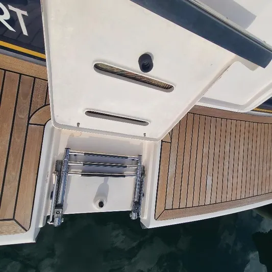 Blue Meridian Yacht Photos Pics 2003 Tiara Yachts 3800 Open swim platform with teak decking and retractable ladder.