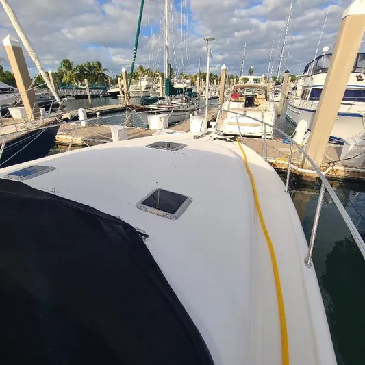 Blue Meridian Yacht Photos Pics 2003 Tiara Yachts 3800 Open docked at marina, surrounded by other boats.