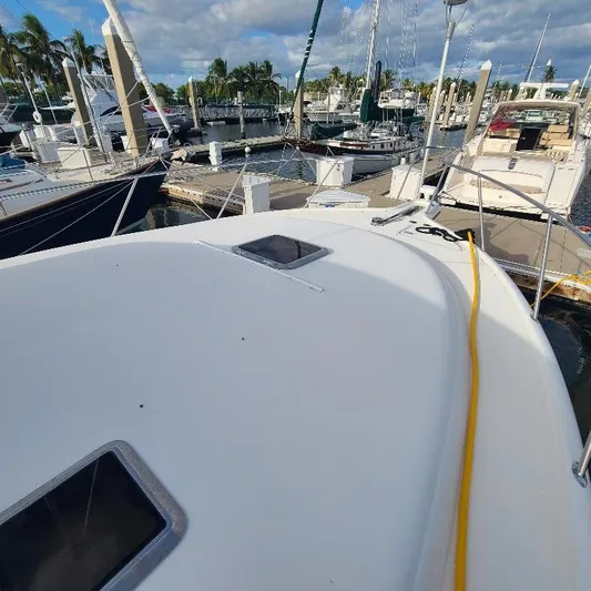 Blue Meridian Yacht Photos Pics 2003 Tiara Yachts 3800 Open docked at marina, surrounded by other boats.