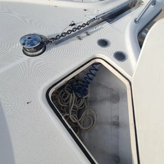 Blue Meridian Yacht Photos Pics Anchor locker of 2003 Tiara Yachts 3800 Open with ropes and chain.