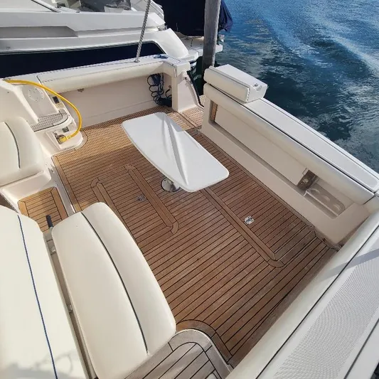 Blue Meridian Yacht Photos Pics 2003 Tiara Yachts 3800 Open boat deck with teak flooring and seating area.