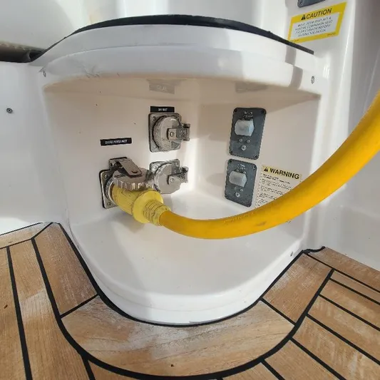 Blue Meridian Yacht Photos Pics Electrical connections on a 2003 Tiara Yachts 3800 Open with yellow power cable.