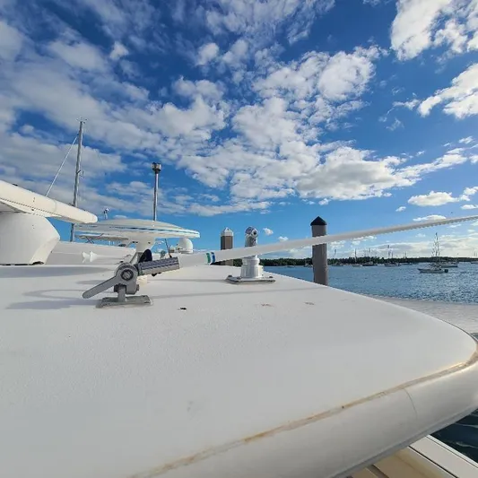 Blue Meridian Yacht Photos Pics 2003 Tiara Yachts 3800 Open on a sunny day with blue sky and clouds.