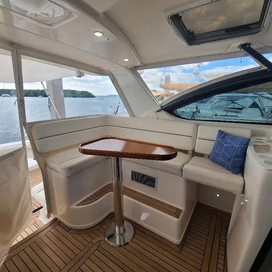 Blue Meridian Yacht Photos Pics 2003 Tiara Yachts 3800 Open interior with seating, table, and scenic water view.