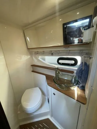 Tin Cup Chalice Yacht Photos Pics 2019 Sea Ray Sundancer 350 Coupe bathroom with modern fixtures and glass sink.