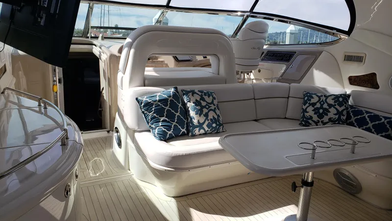 Pacific Dancer Yacht Photos Pics Luxurious interior of 2004 Sea Ray 550 Sundancer yacht with plush seating and elegant decor.