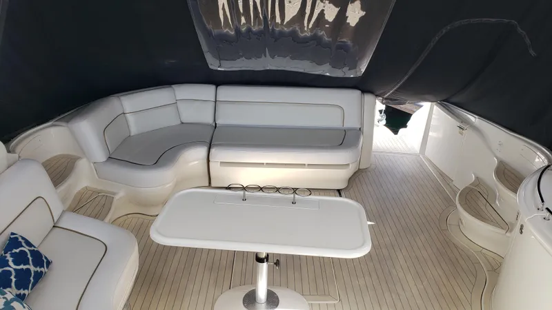 Pacific Dancer Yacht Photos Pics Luxurious interior of 2004 Sea Ray 550 Sundancer yacht with elegant seating and table.