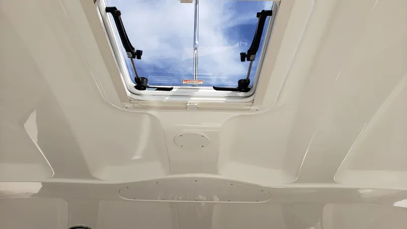 Pacific Dancer Yacht Photos Pics 2004 Sea Ray 550 Sundancer cabin skylight with open hatch and blue sky view.