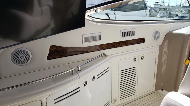 Pacific Dancer Yacht Photos Pics Interior view of a 2004 Sea Ray 550 Sundancer yacht, featuring speakers and storage compartments.
