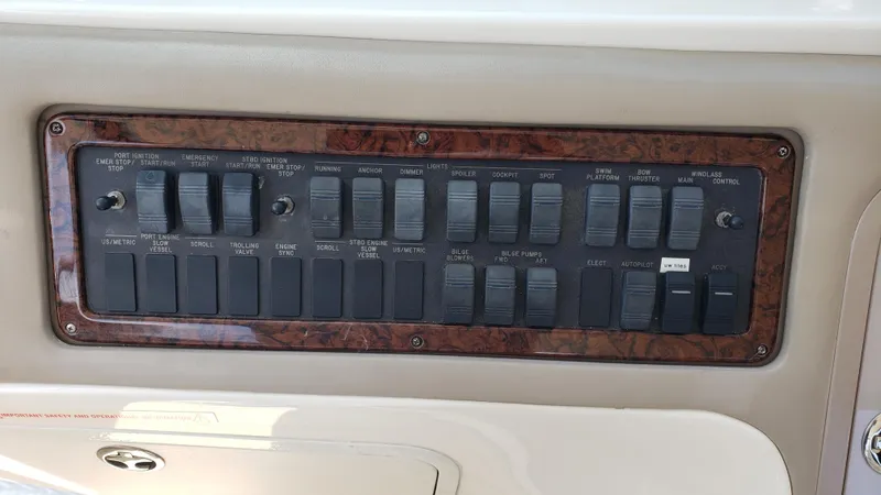 Pacific Dancer Yacht Photos Pics Control panel of a 2004 Sea Ray 550 Sundancer boat with multiple switches.