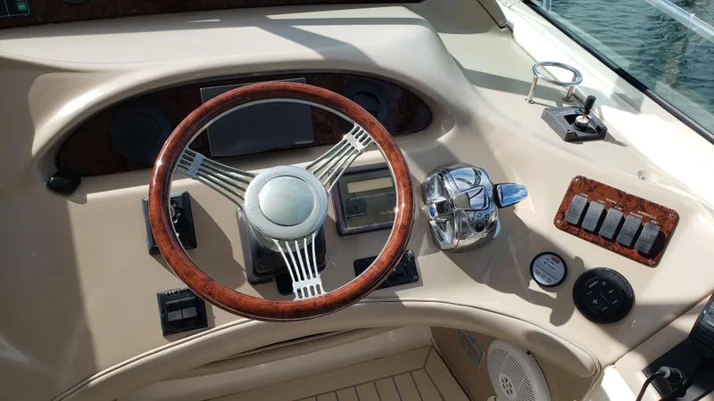 Pacific Dancer Yacht Photos Pics Steering wheel and controls of a 2004 Sea Ray 550 Sundancer yacht.