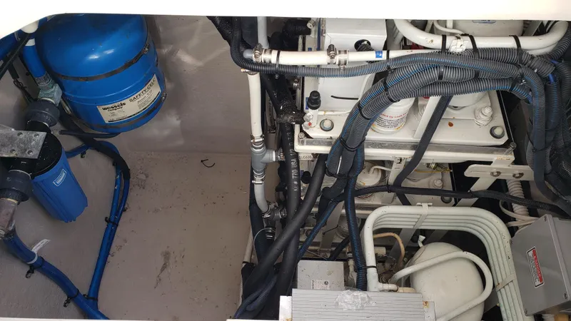 Pacific Dancer Yacht Photos Pics Engine room of 2004 Sea Ray 550 Sundancer with visible components and wiring.