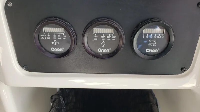 Pacific Dancer Yacht Photos Pics Instrument panel of a 2004 Sea Ray 550 Sundancer with Onan gauges.