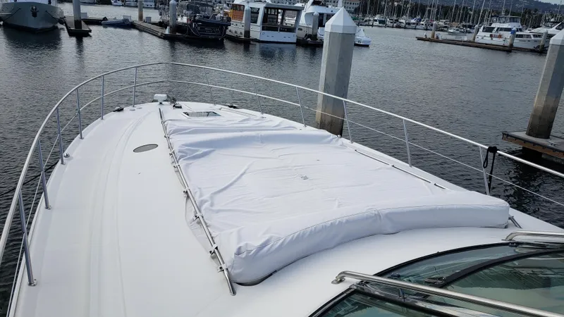 Pacific Dancer Yacht Photos Pics 2004 Sea Ray 550 Sundancer yacht docked at marina, covered deck, calm waters.