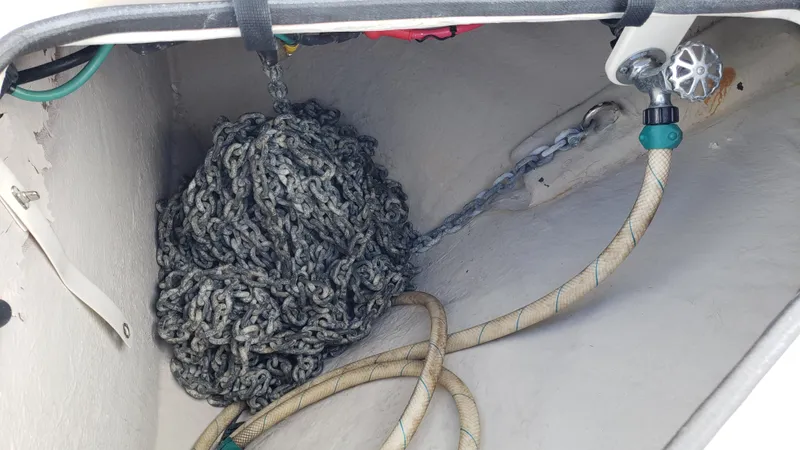 Pacific Dancer Yacht Photos Pics Anchor chain and hose in a 2004 Sea Ray 550 Sundancer boat compartment.