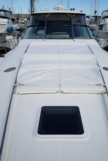 Pacific Dancer Yacht Photos Pics 2004 Sea Ray 550 Sundancer yacht with covered deck, docked at marina.