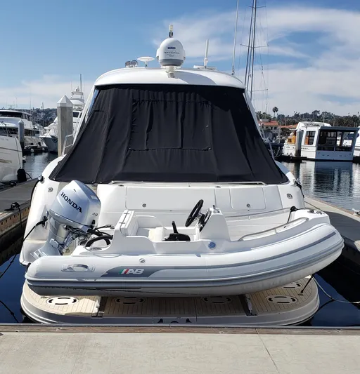 Pacific Dancer Yacht Photos Pics 2004 Sea Ray 550 Sundancer yacht with inflatable boat, docked at marina.