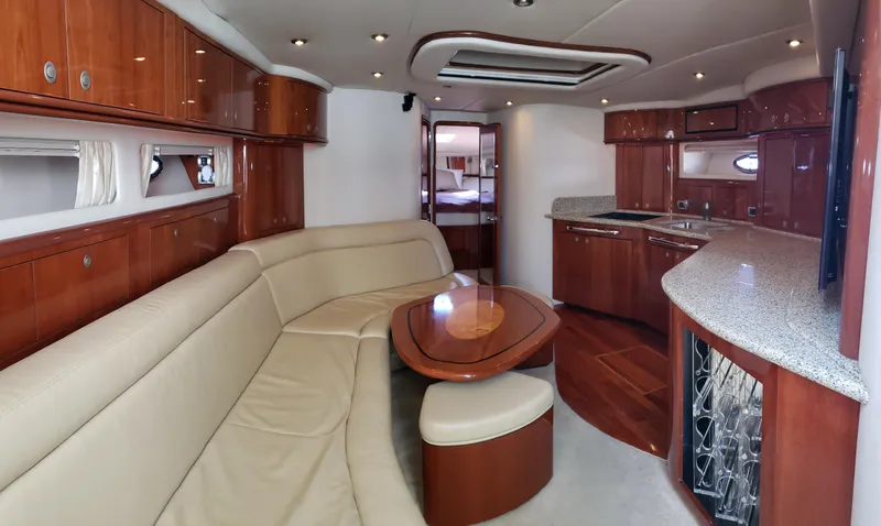 Pacific Dancer Yacht Photos Pics Luxurious interior of 2004 Sea Ray 550 Sundancer yacht with leather seating and modern kitchen.